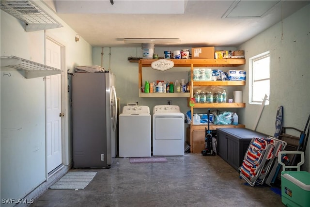 5870 Star Grass Ln, Naples, FL 34116 - laundry room featuring washing machine and clothes dryer