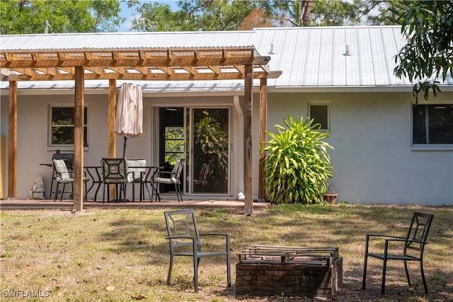 5870 Star Grass Ln, Naples, FL 34116 - back of property featuring stucco siding, a pergola, a patio area, and a yard
