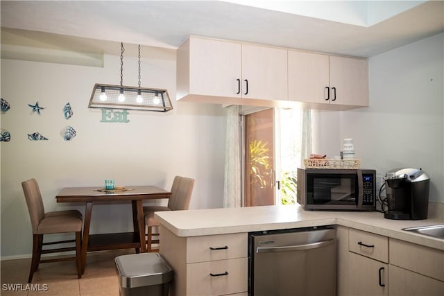 5870 Star Grass Ln, Naples, FL 34116 - kitchen featuring stainless steel dishwasher, light countertops, and a peninsula