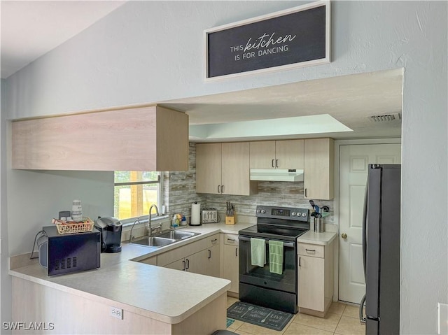 5870 Star Grass Ln, Naples, FL 34116 - kitchen featuring black electric range oven, freestanding refrigerator, under cabinet range hood, tasteful backsplash, and light countertops