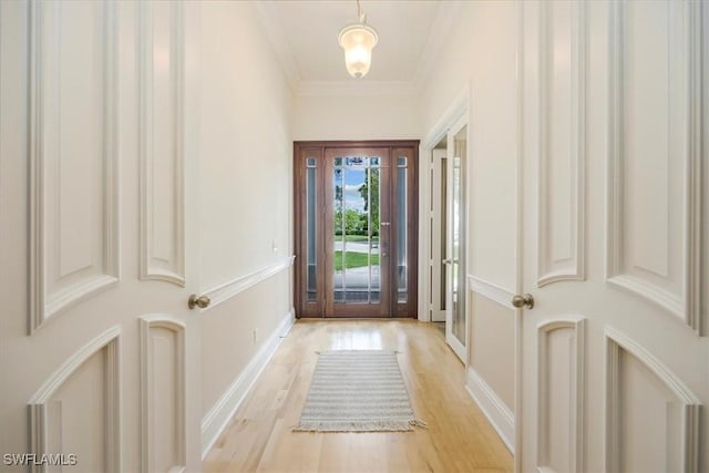 2457 Dorset Ct, Naples, FL 34112 - doorway to outside with light wood-type flooring and crown molding