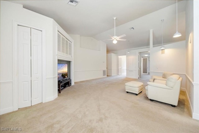 2457 Dorset Ct, Naples, FL 34112 - carpeted living area with vaulted ceiling and a ceiling fan