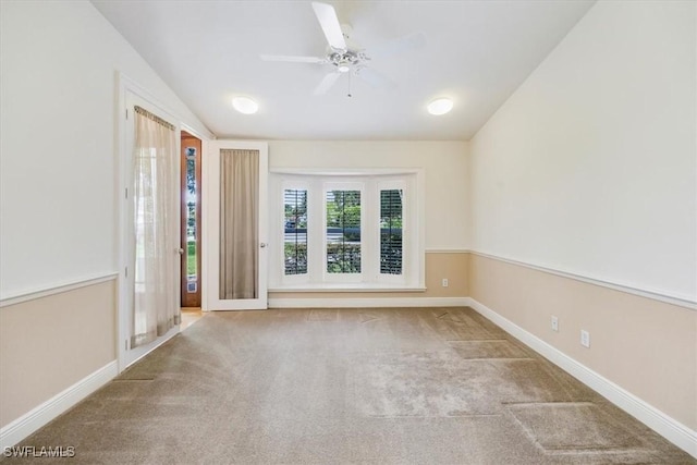 2457 Dorset Ct, Naples, FL 34112 - empty room with carpet flooring, ceiling fan, and lofted ceiling