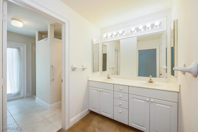2457 Dorset Ct, Naples, FL 34112 - bathroom with double vanity and tile patterned floors
