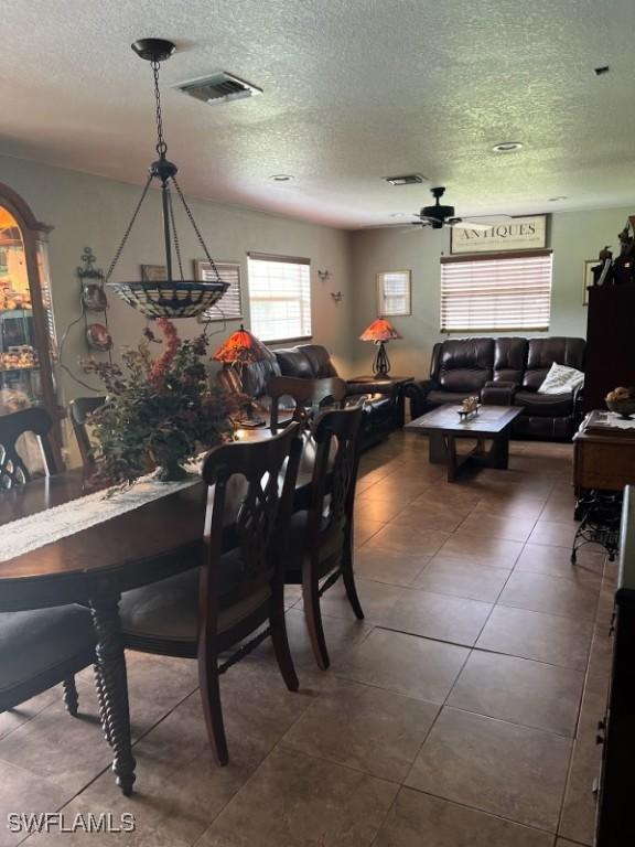 826 B Rd, Labelle, FL 33935 - tiled dining area with a textured ceiling and ceiling fan