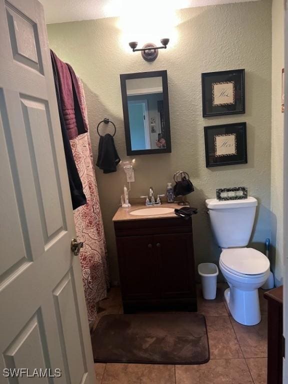 826 B Rd, Labelle, FL 33935 - bathroom featuring vanity, tile patterned floors, and a textured wall
