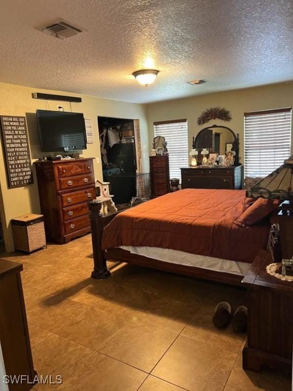 826 B Rd, Labelle, FL 33935 - bedroom featuring a textured ceiling and light tile patterned flooring