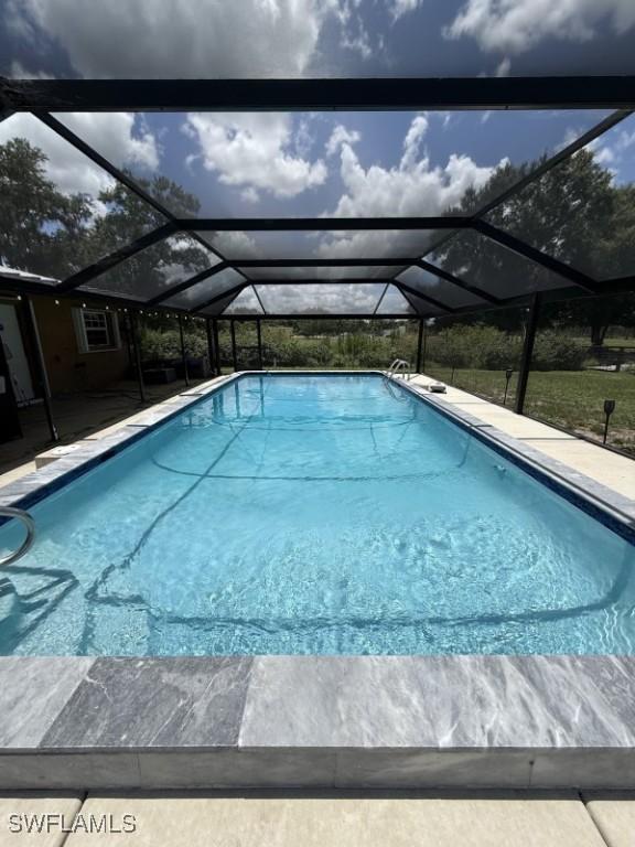 826 B Rd, Labelle, FL 33935 - swimming pool with a lanai and a patio