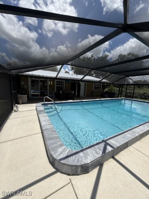 826 B Rd, Labelle, FL 33935 - outdoor pool with a lanai and a patio
