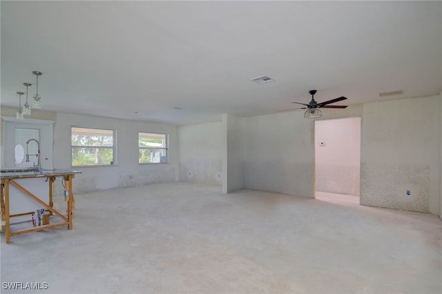 330 Shore Dr, Fort Myers, FL 33905 - unfurnished living room with ceiling fan and light colored carpet