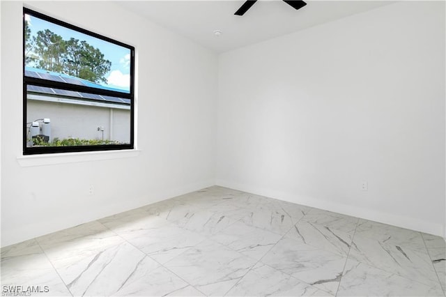 5300 3rd St W, Lehigh Acres, FL 33971 - empty room featuring a ceiling fan and marble finish floors