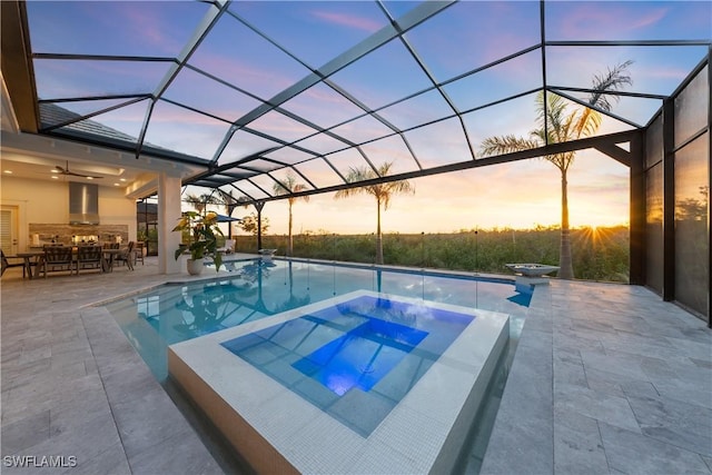 8923 Nevis Way, Naples, FL 34112 - view of swimming pool featuring a patio, a pool with connected hot tub, and a lanai