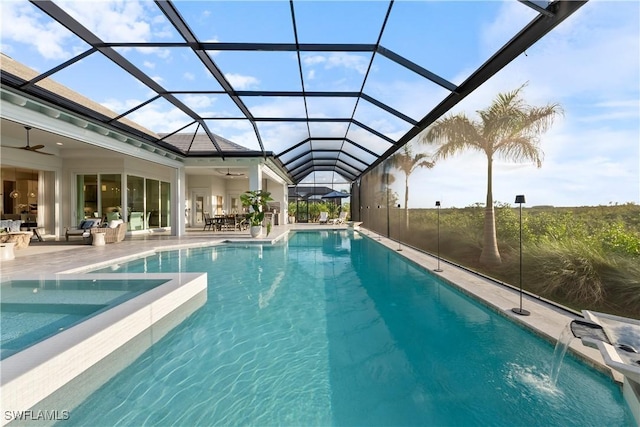 8923 Nevis Way, Naples, FL 34112 - swimming pool with ceiling fan, a patio area, an outdoor hangout area, and glass enclosure