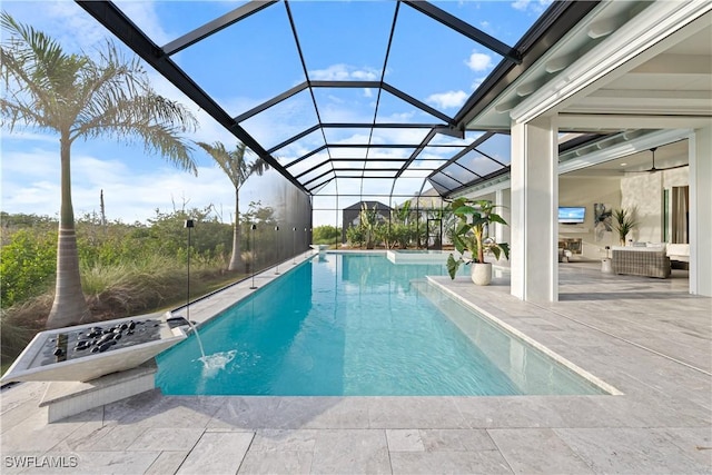 8923 Nevis Way, Naples, FL 34112 - swimming pool featuring a patio area, glass enclosure, and an outdoor living space