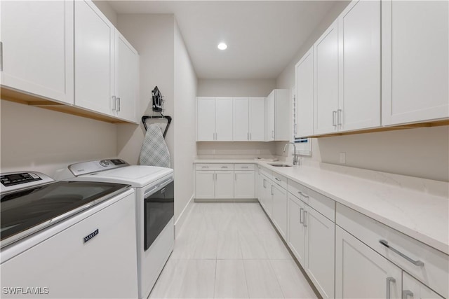 8923 Nevis Way, Naples, FL 34112 - washroom featuring separate washer and dryer, cabinet space, recessed lighting, and light tile patterned floors