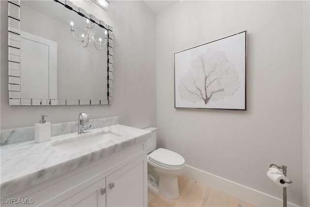 8923 Nevis Way, Naples, FL 34112 - bathroom with vanity and wood finished floors