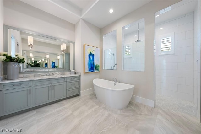 8923 Nevis Way, Naples, FL 34112 - bathroom featuring walk in shower, vanity, a soaking tub, and recessed lighting