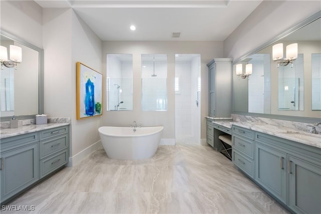 8923 Nevis Way, Naples, FL 34112 - full bath with a chandelier, walk in shower, two vanities, a freestanding tub, and marble finish floors