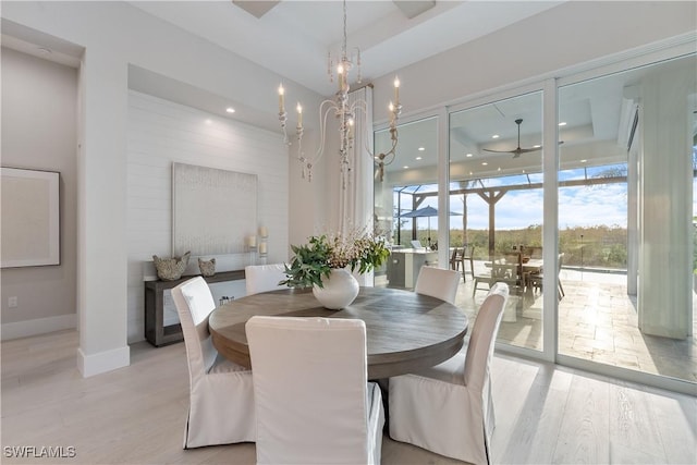 8923 Nevis Way, Naples, FL 34112 - dining space featuring light wood-style floors, a chandelier, recessed lighting, and a ceiling fan