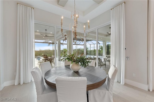 8923 Nevis Way, Naples, FL 34112 - dining space featuring a chandelier and healthy amount of natural light