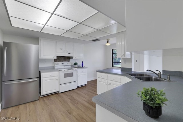 4925 Molokai Dr Unit 16, Naples, FL 34112 - kitchen with freestanding refrigerator, white range with electric stovetop, under cabinet range hood, light wood-style floors, and white cabinetry