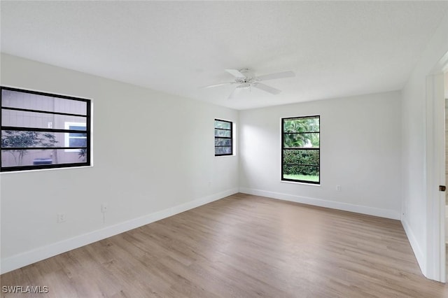 4925 Molokai Dr Unit 16, Naples, FL 34112 - unfurnished room featuring wood finished floors and a ceiling fan