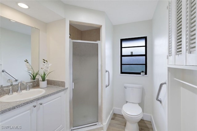 4925 Molokai Dr Unit 16, Naples, FL 34112 - full bath with vanity, a stall shower, and wood finished floors