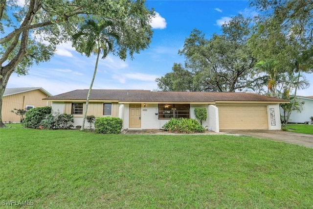 4925 Molokai Dr Unit 16, Naples, FL 34112 - ranch-style house featuring an attached garage, concrete driveway, a front yard, and stucco siding