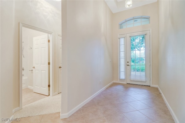 11970 Bramble Cove Dr, Fort Myers, FL 33905 - entrance foyer featuring light tile patterned flooring and a towering ceiling