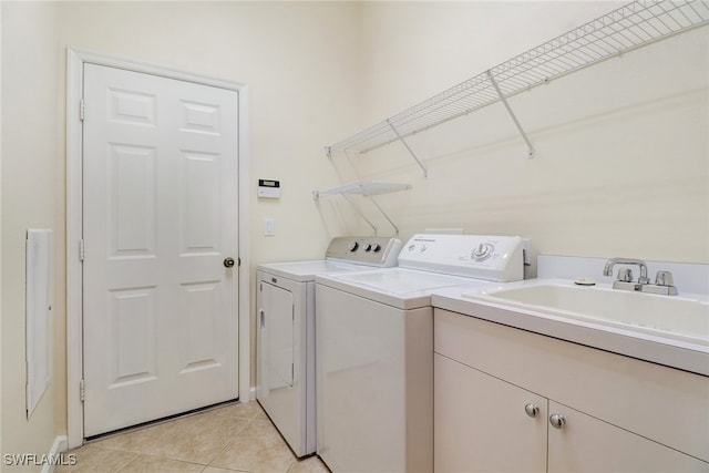11970 Bramble Cove Dr, Fort Myers, FL 33905 - laundry room featuring independent washer and dryer, light tile patterned floors, and cabinet space
