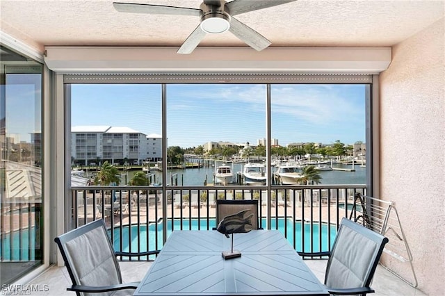 170 Lenell Rd Unit 202, Fort Myers Beach, FL 33931 - sunroom featuring a water view