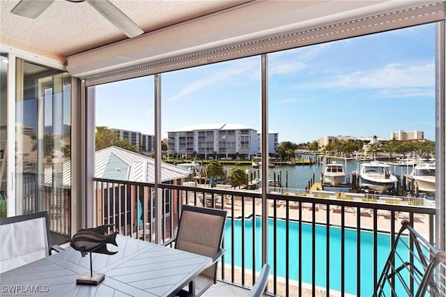 170 Lenell Rd Unit 202, Fort Myers Beach, FL 33931 - sunroom featuring a water view