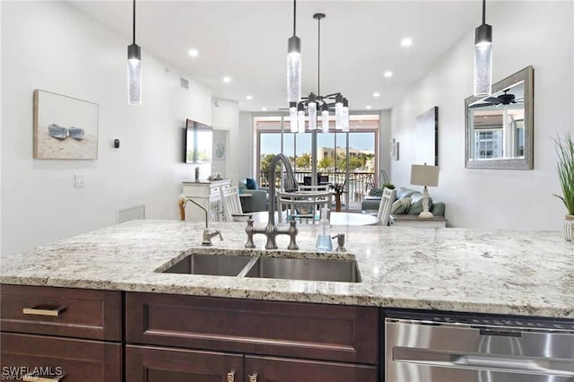 170 Lenell Rd Unit 202, Fort Myers Beach, FL 33931 - kitchen featuring dishwasher, dark brown cabinetry, open floor plan, light stone counters, and recessed lighting