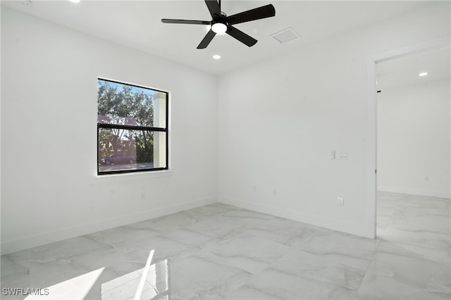 4881/4883 Leonard Blvd S, Lehigh Acres, FL 33973 - spare room featuring recessed lighting, marble look tile flooring, and a ceiling fan