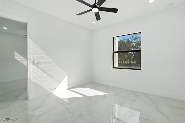 4881/4883 Leonard Blvd S, Lehigh Acres, FL 33973 - empty room with recessed lighting, marble look tiles, a ceiling fan, and a smoke detector