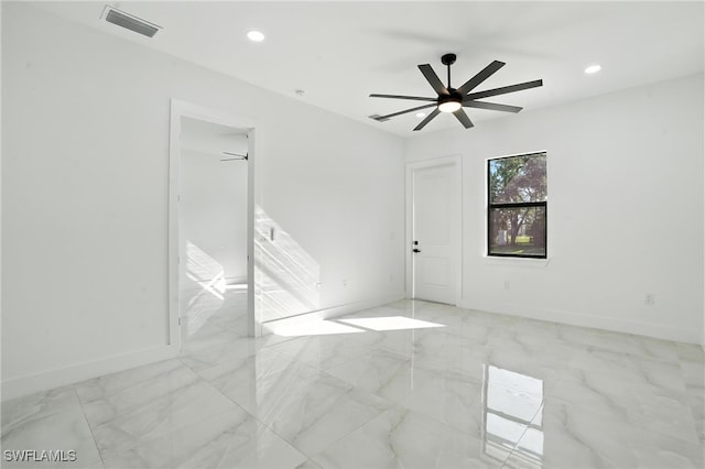 4881/4883 Leonard Blvd S, Lehigh Acres, FL 33973 - unfurnished room featuring light marble finish flooring, a ceiling fan, and recessed lighting