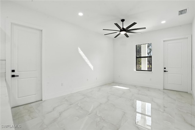 4881/4883 Leonard Blvd S, Lehigh Acres, FL 33973 - spare room with light marble finish floors, a ceiling fan, and recessed lighting