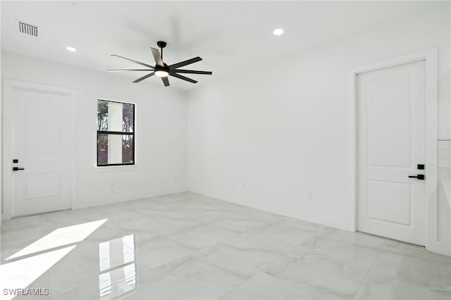 4881/4883 Leonard Blvd S, Lehigh Acres, FL 33973 - spare room with ceiling fan, light marble finish floors, and recessed lighting