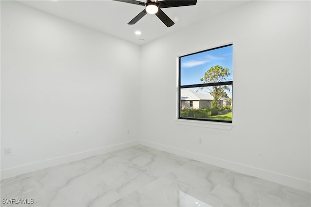 4881/4883 Leonard Blvd S, Lehigh Acres, FL 33973 - spare room featuring marble finish floors, a ceiling fan, and recessed lighting