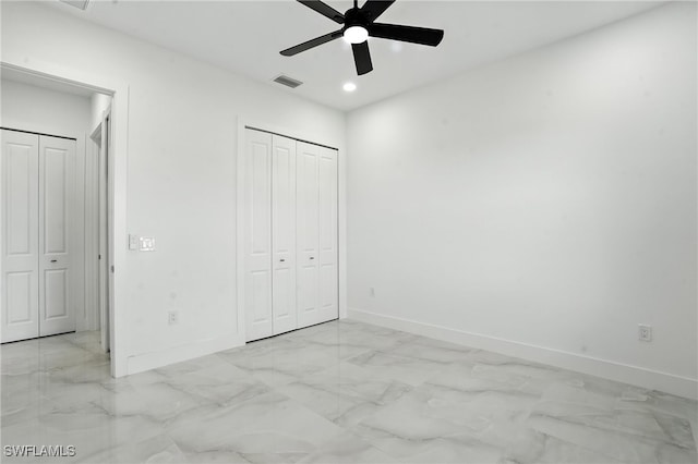 4881/4883 Leonard Blvd S, Lehigh Acres, FL 33973 - unfurnished bedroom with light marble finish flooring, recessed lighting, and ceiling fan