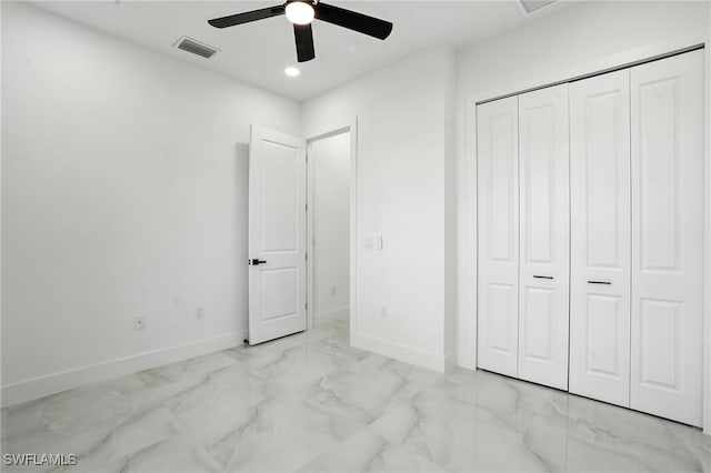 4881/4883 Leonard Blvd S, Lehigh Acres, FL 33973 - unfurnished bedroom featuring marble look tiles, recessed lighting, a closet, and ceiling fan