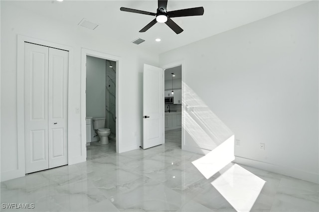 4881/4883 Leonard Blvd S, Lehigh Acres, FL 33973 - unfurnished bedroom with light marble finish floors, ensuite bathroom, recessed lighting, and ceiling fan