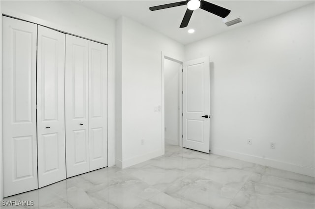 4881/4883 Leonard Blvd S, Lehigh Acres, FL 33973 - unfurnished bedroom with marble look tile flooring, a closet, recessed lighting, and a ceiling fan