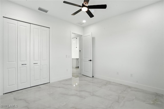 4881/4883 Leonard Blvd S, Lehigh Acres, FL 33973 - unfurnished bedroom with marble tiled floors, a closet, recessed lighting, and a ceiling fan