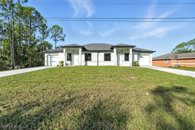 4881/4883 Leonard Blvd S, Lehigh Acres, FL 33973 - prairie-style home with driveway, an attached garage, stucco siding, and a front yard