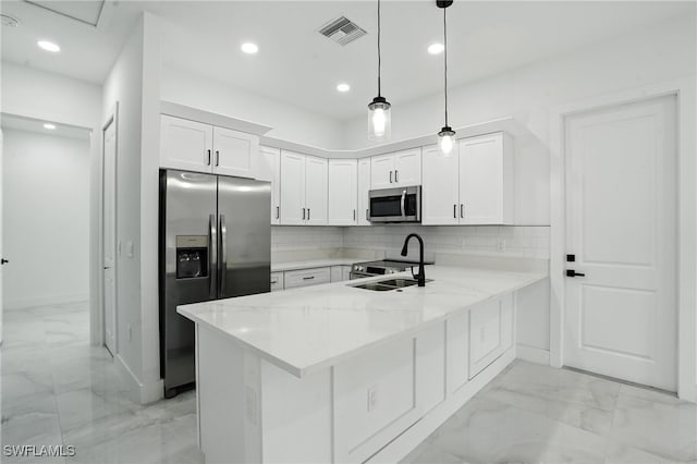 4881/4883 Leonard Blvd S, Lehigh Acres, FL 33973 - kitchen with stainless steel appliances, light marble finish flooring, a peninsula, recessed lighting, and white cabinetry