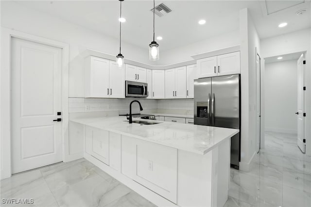 4881/4883 Leonard Blvd S, Lehigh Acres, FL 33973 - kitchen with appliances with stainless steel finishes, light marble finish flooring, a peninsula, recessed lighting, and white cabinetry
