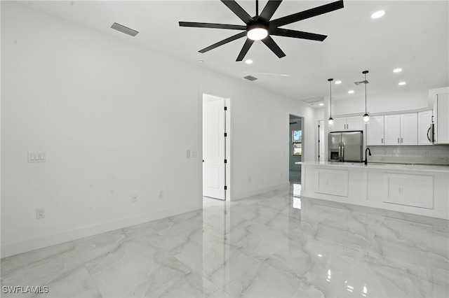4881/4883 Leonard Blvd S, Lehigh Acres, FL 33973 - unfurnished living room with recessed lighting, light marble finish flooring, and a ceiling fan