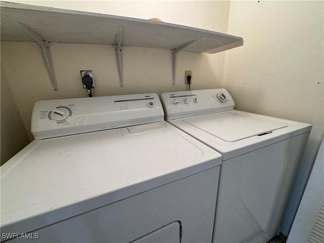 1069 Villa Dr Unit B103, Labelle, FL 33935 - laundry area with separate washer and dryer
