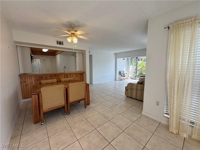 1069 Villa Dr Unit B103, Labelle, FL 33935 - dining room with ceiling fan, light tile patterned flooring, and a textured ceiling